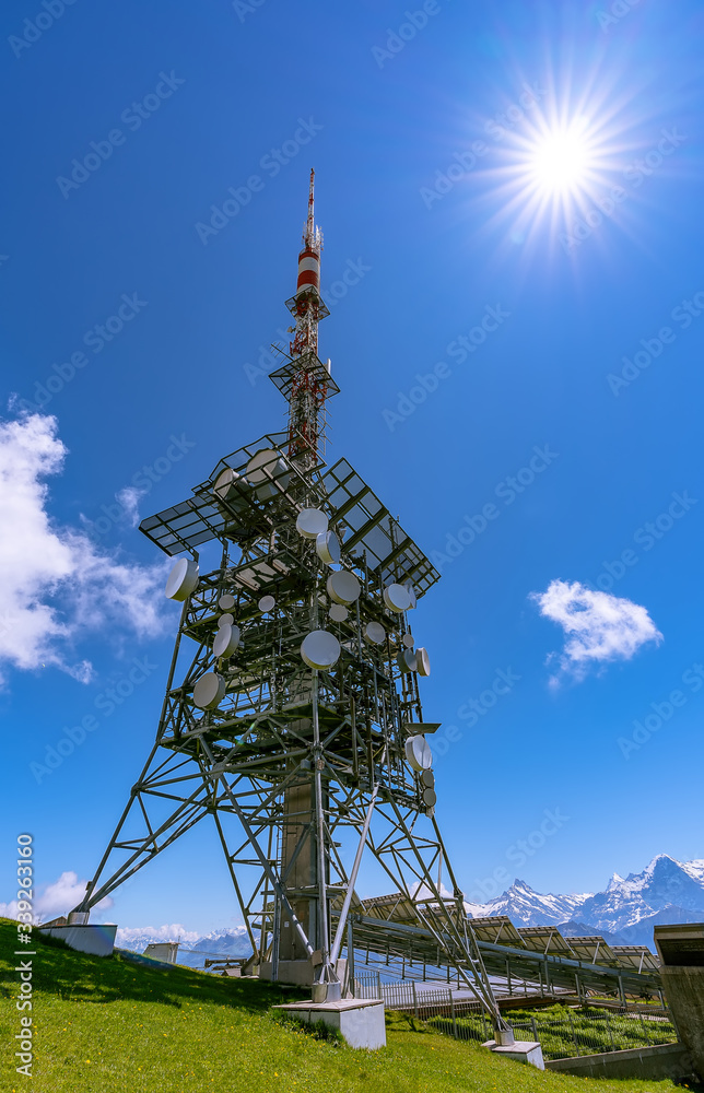 Communications tower and solar panels on top of Mount Niederhorn that supply electricity Communications tower and solar panels on top of Mount Niederhorn that supply electricity