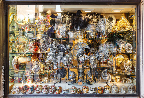Old town of Venice. A showcase of a souvenir shop with masks on a narrow street away from Piazza San Marco in Venice, Italy