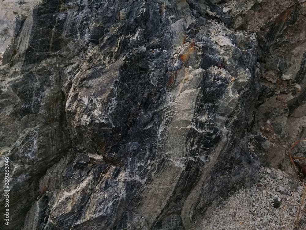 texture of chert rock in the nature. Chert is a sedimentary rock composed of microcrystalline or cryptocrystalline quartz, the mineral form of silicon dioxide.