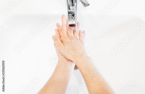 Man washing his hands hygienically
