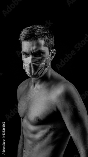 covid-19 sexy man with mask on black baground (ID: 339266162)