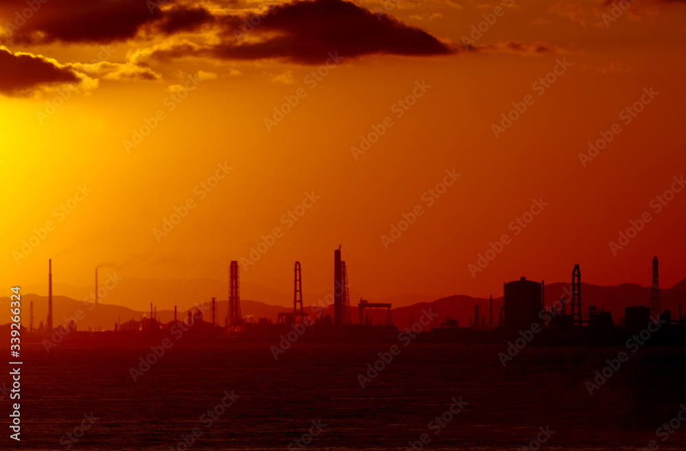 sunrise in seabeach at industrial city in Japan