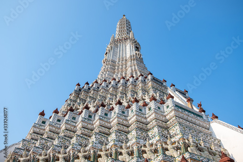 Wat Arun temple in a blue sky. Wat Arun is a Buddhist temple in Bangkok, Thailand. photo