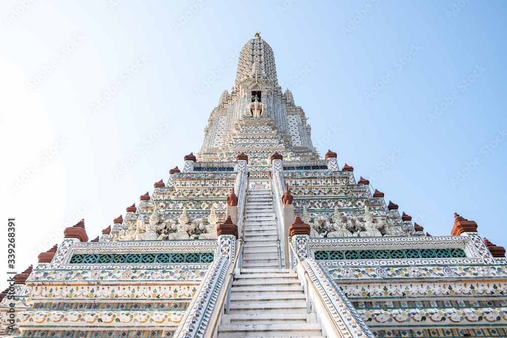 Wat Arun temple in a blue sky. Wat Arun is a Buddhist temple in Bangkok, Thailand.