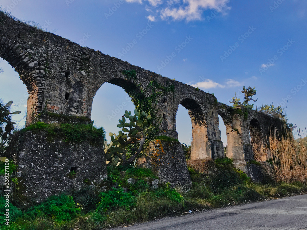 Arches of an ancient aqueduct that supplied a mill, Italy.