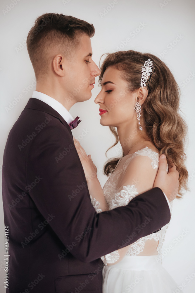 Stock Photo - Portrait of beautiful young wedding couple 