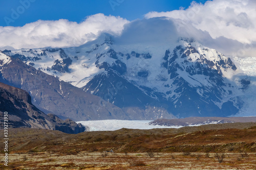 Beautiful blue iced glaciers retreating back into the mountains on the south east of Iceland © Jorge Moro