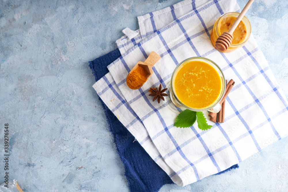 Turmeric milk. Cooked golden milk in a glass Turmeric milk. Cooked golden milk in a glass