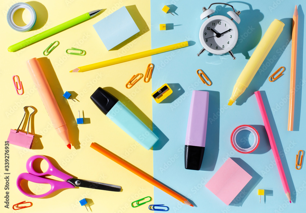 Children's accessories for study, creativity and office supplies on a colored paper background. Back to school concept