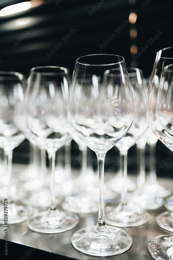 many clean wineglasses in bar, professional equipment many clean wineglasses in bar, professional equipment