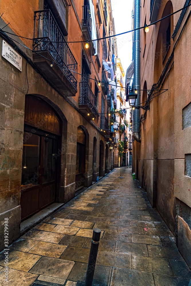 narrow street in barcelona. door to door. window to window
