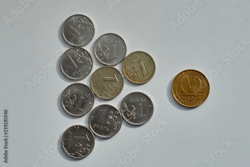 Round coins. Cutting of money with a knife
