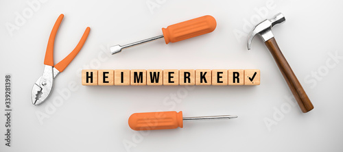 set of tools and cubes with German message for HOME HANDYMAN on white background