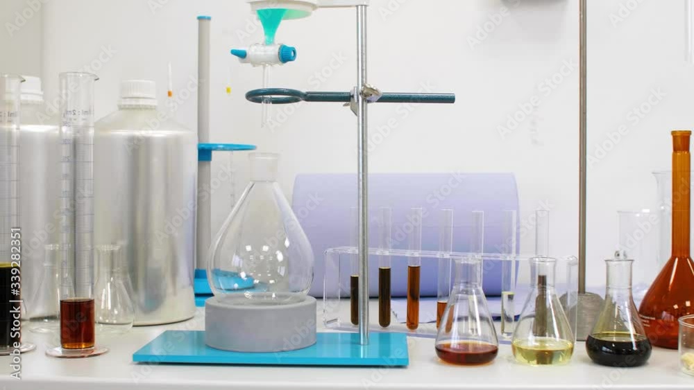 CBD oil, hemp seeds and terpenes in glass on laboratory desk CBD oil, hemp seeds and terpenes in glass on laboratory desk