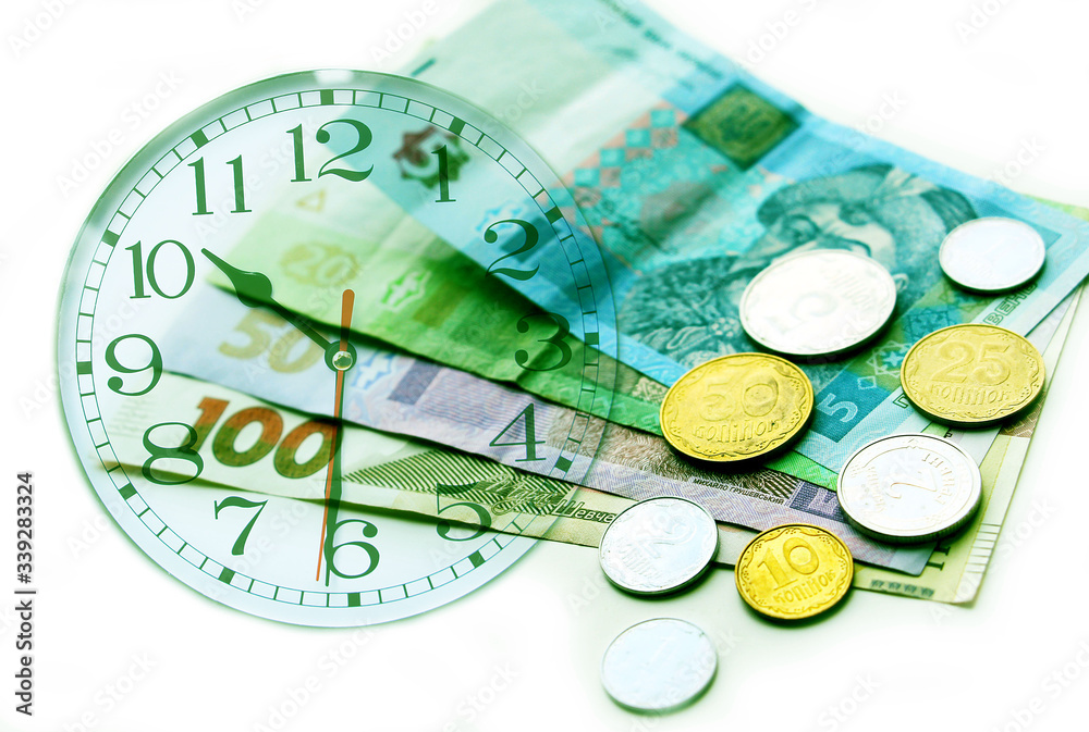 Ukrainian money, coins and time. Dial on a financial background. Ukrainian money, coins and time. Dial on a financial background.
