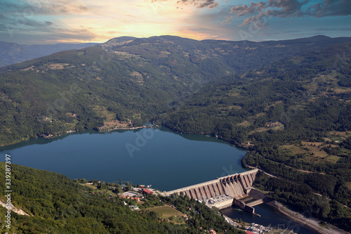 hydroelectric power plant on river sunset landscape