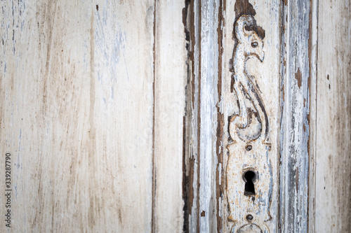 Wallpaper Mural Vintage chest of drawers with carving white color with fading and metal handle. Close-up. Selective focus Torontodigital.ca