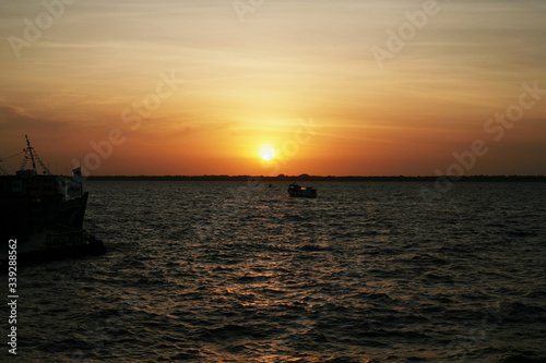 sunset on amazon river © alexandre