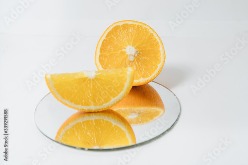 Sliced orange fruit segments isolated on white