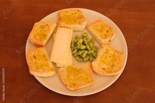 homemade bread with  extra virgin olive oil, fava beans and cheese