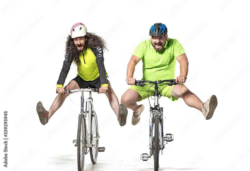 Plump and skinny guys riding bicycles