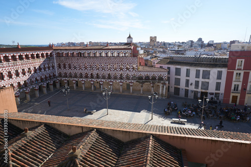 Plaza Alta red and white buildings in Badajoz, Spain photo