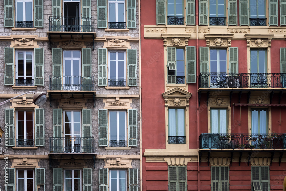 Nice, France - April 2017: Colours and styles of Nice classic apartment buidlings