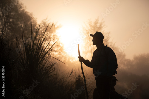 Sunrise over a park ranger in Chitwan, Nepal