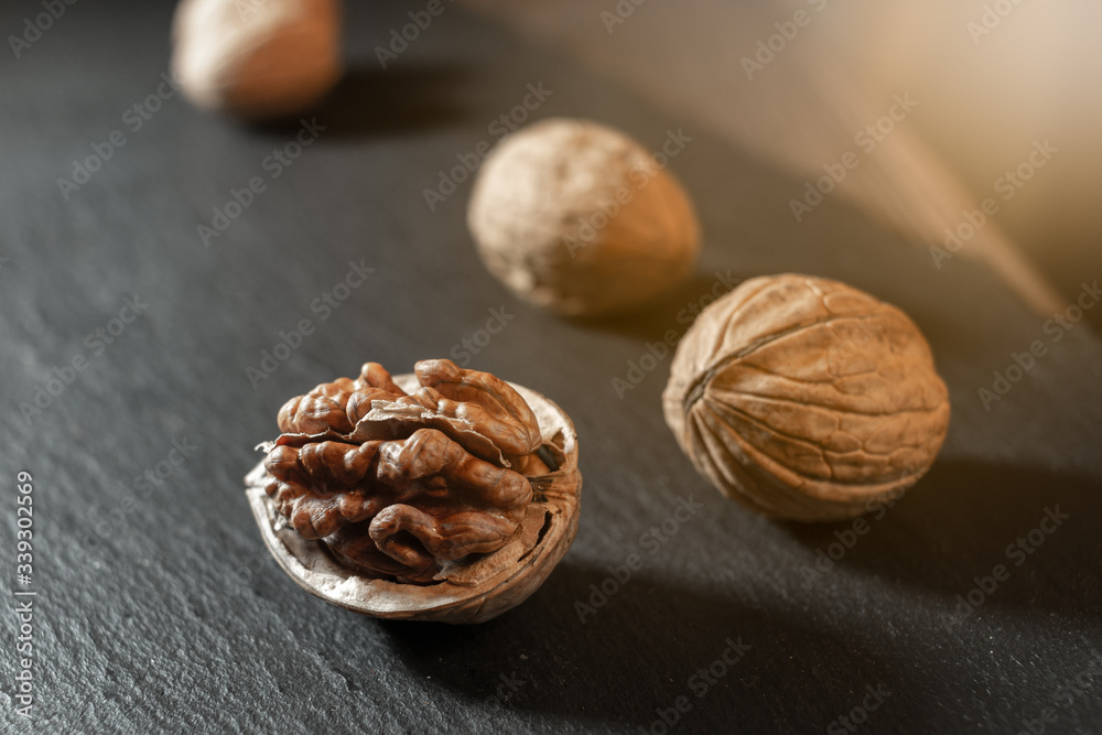Whole walnuts on dark board. Whole walnuts on dark board.