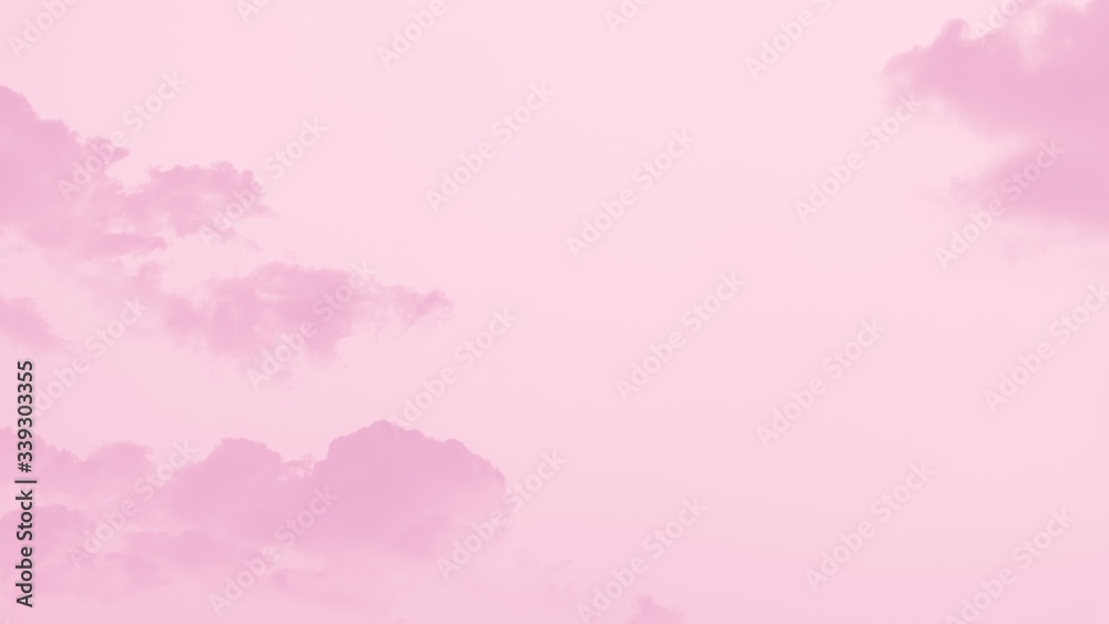 Beautiful soft fluffy clouds on a pale pink sky background. 16:9 panoramic format