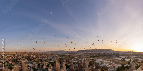 Colorfull high detailed panorama with hot air balloons at sunrise in Goreme national park, Cappadocia, Turkey. Beautifull background photo. 