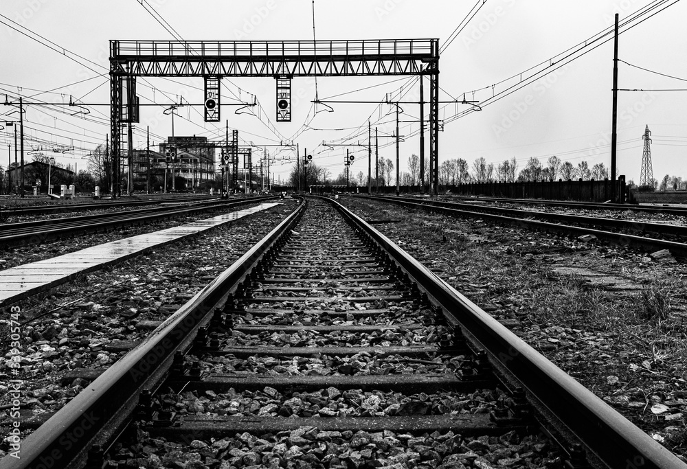 Empty railroad tracks on a rainy day