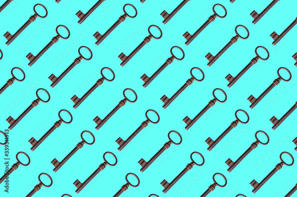  pattern of old rusty keys on a blue background. the key is repeated many times