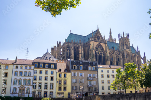 View on the riverside with beautiful old buildings, Cathedral of St. Stephen on the background, Metz, Lorraine, France
