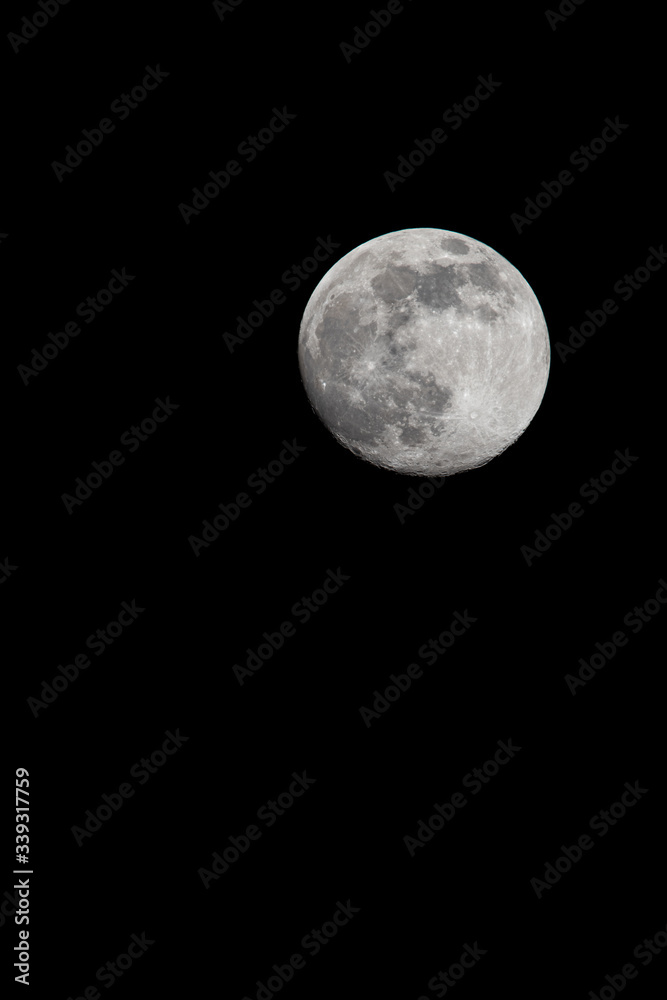 Almost full moon close up shot in a clear sky Almost full moon close up shot in a clear sky