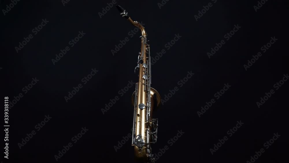 Wind Instrument Saxophone On A Black Background. Wind Instrument Saxophone On A Black Background.