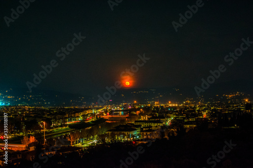 Florence by night the beautiful city with the landmark and famous red sun 
