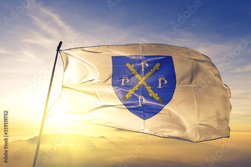 Philippeville of Namur of Belgium flag waving on the top sunrise mist fog photo