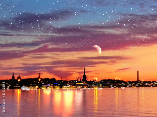 Photography beautiful romantic starry night and full moon on blue sky at sea , city promenad