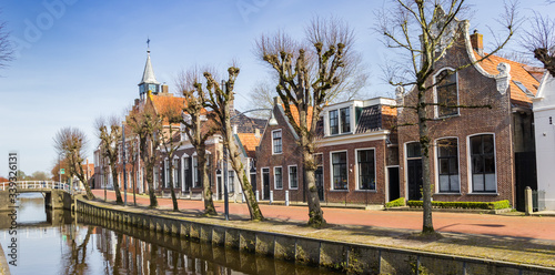 Bilde på lerret Panorama of historic town hall and old houses at the canal in Balk, Netherlands