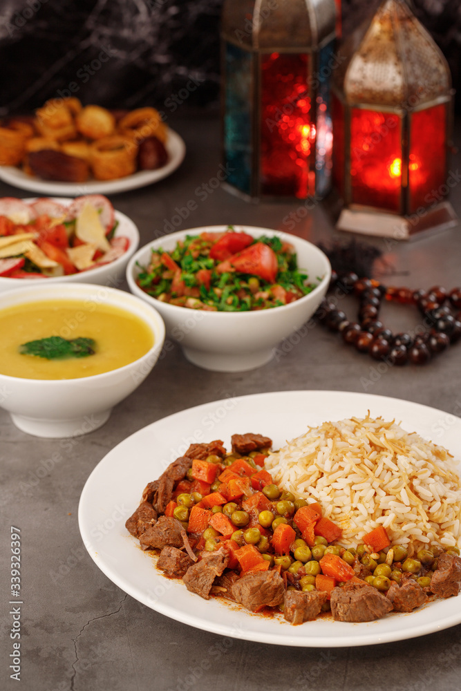 Ramadan. Arabic family dinner. Traditional arabic food. Close-up view. Eid Mubarak. Table with sharing plates food. Ramadan decoration. Lebanese cuisine. Starters, hummus, baklava, dates. Muslim Ramadan. Arabic family dinner. Traditional arabic food. Close-up view. Eid Mubarak. Table with sharing plates food. Ramadan decoration. Lebanese cuisine. Starters, hummus, baklava, dates. Muslim