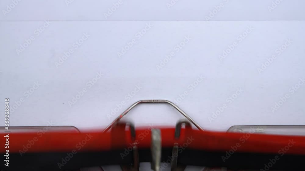 Real estate purchase agreement - phrase printed on an old typewriter in red letters, close up. vintage inscription Real estate purchase agreement - phrase printed on an old typewriter in red letters, close up. vintage inscription