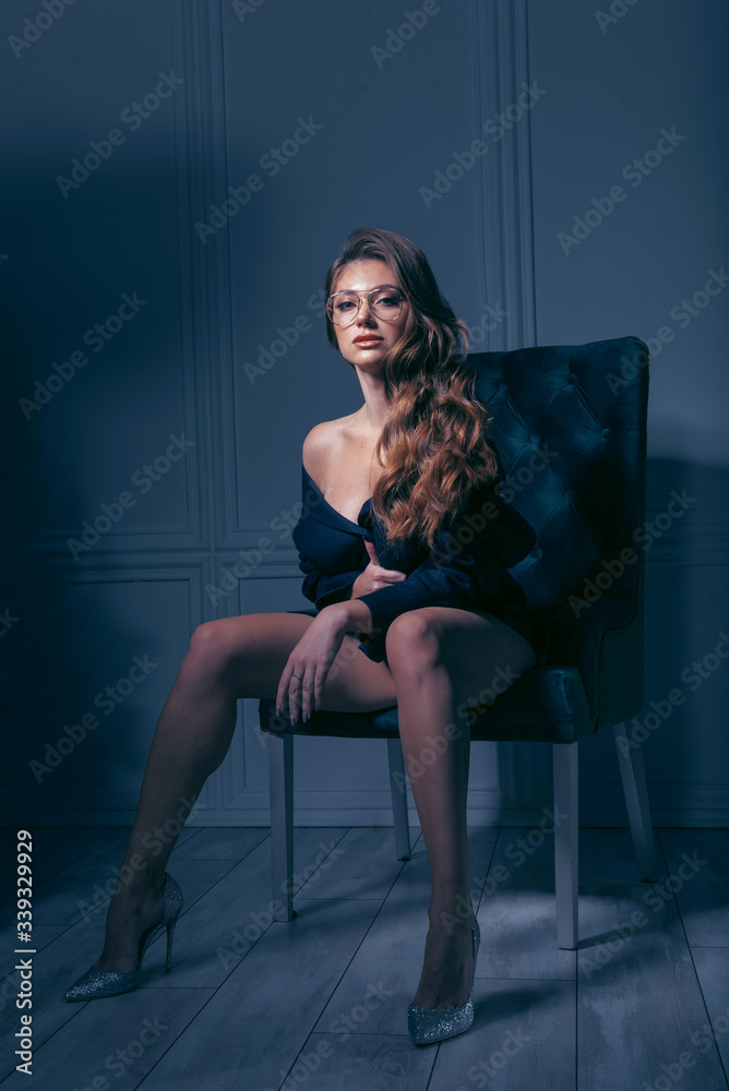 Naklejka premium sensual woman in a chair