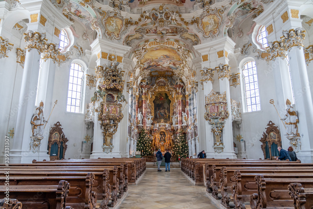 Visitors admire front facade with main altar inside Pilgrimage Church of Wies Wieskirche