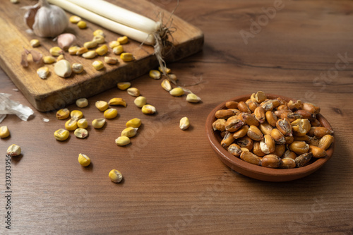 FRIED CORN WITH INGREDIENTS FOR ITS PREPARATION. TYPICAL KITCHEN OF ECUADOR CALLED TOSTADO.