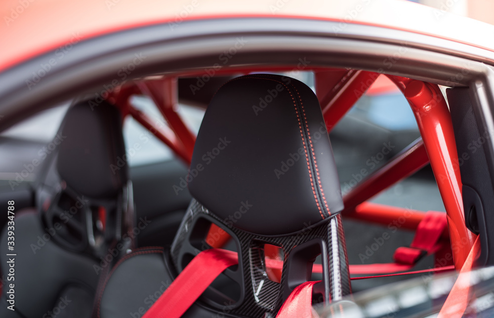 Black seats and red security belts of a car