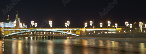 Moscow cityscape in night. Kremlin wall, Towers,Grand Kremlin Palace, Ivan the Great Bell Tower, Dormition Cathedral, Bolshoy Kamenny Bridge. 