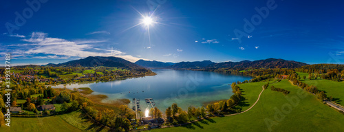 Fantastic panoramic view over the bavarian lake Tegernsee in autumn with fall colors  made by a drone.