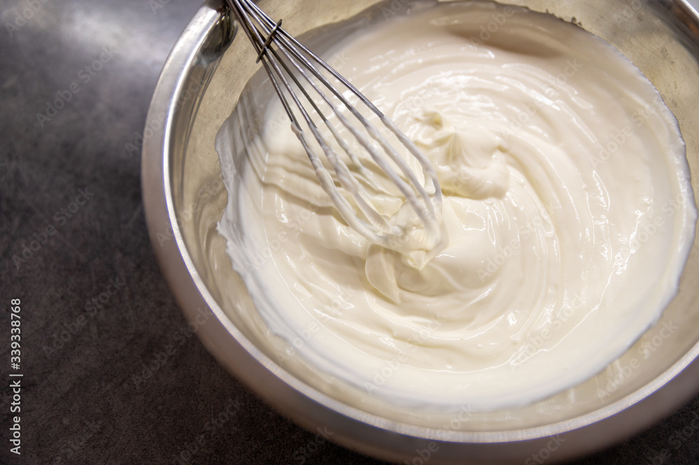 Whipped cream white in bowl, top view Whipped cream white in bowl, top view