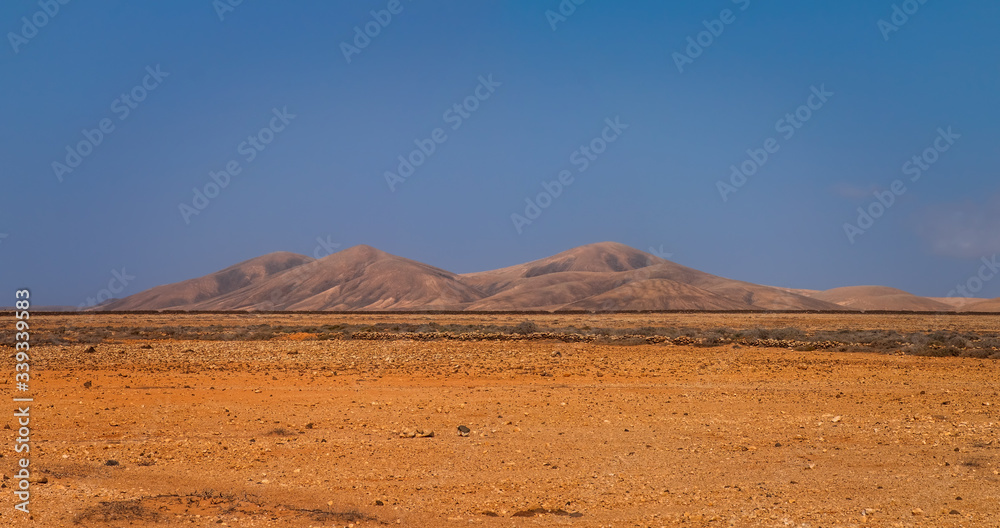 The beautiful volcanic landscape with Bailadero De Las Brujas on the island of Fuerteventura. Canary Islands. Spain. October 2019 The beautiful volcanic landscape with Bailadero De Las Brujas on the island of Fuerteventura. Canary Islands. Spain. October 2019